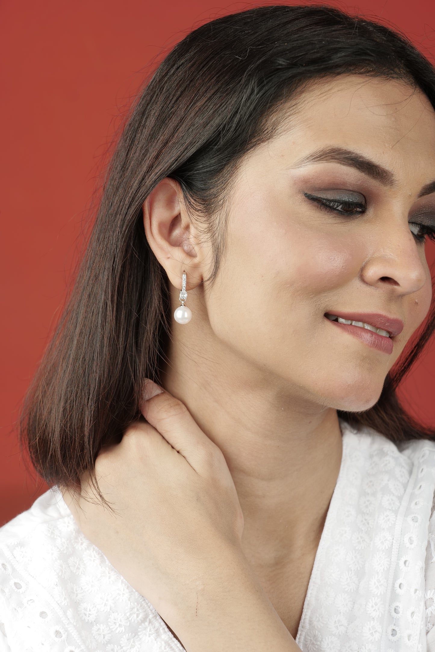 PEARL AND AMERICAN DIAMOND STUDDED EARRINGS