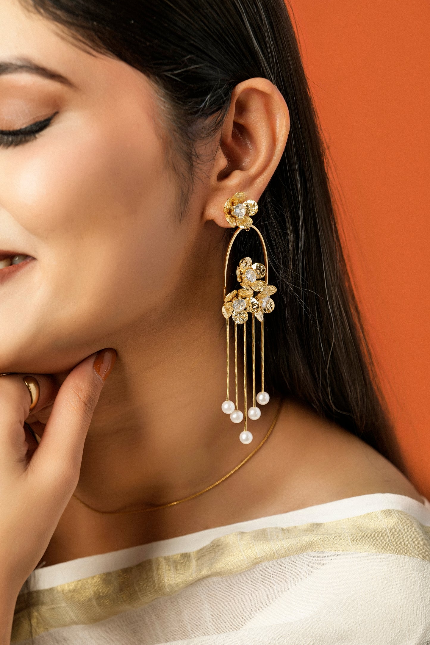 GOLDEN PEARL CASCADE STATEMENT EARRINGS.