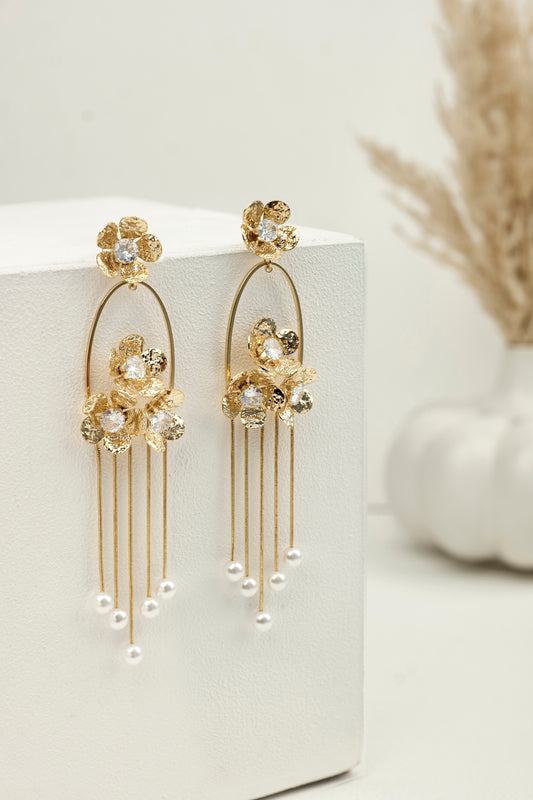 GOLDEN PEARL CASCADE STATEMENT EARRINGS.