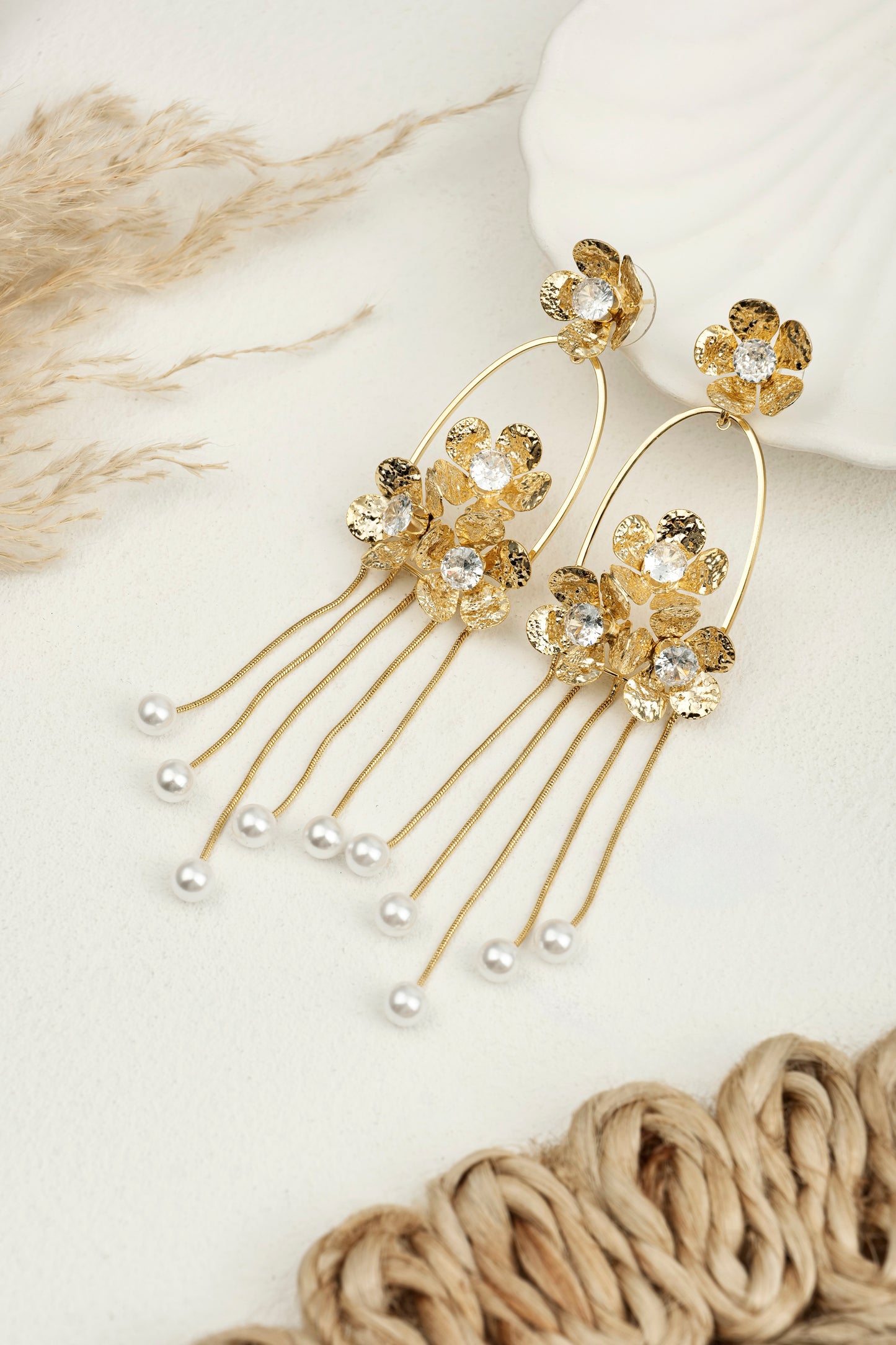 GOLDEN PEARL CASCADE STATEMENT EARRINGS.
