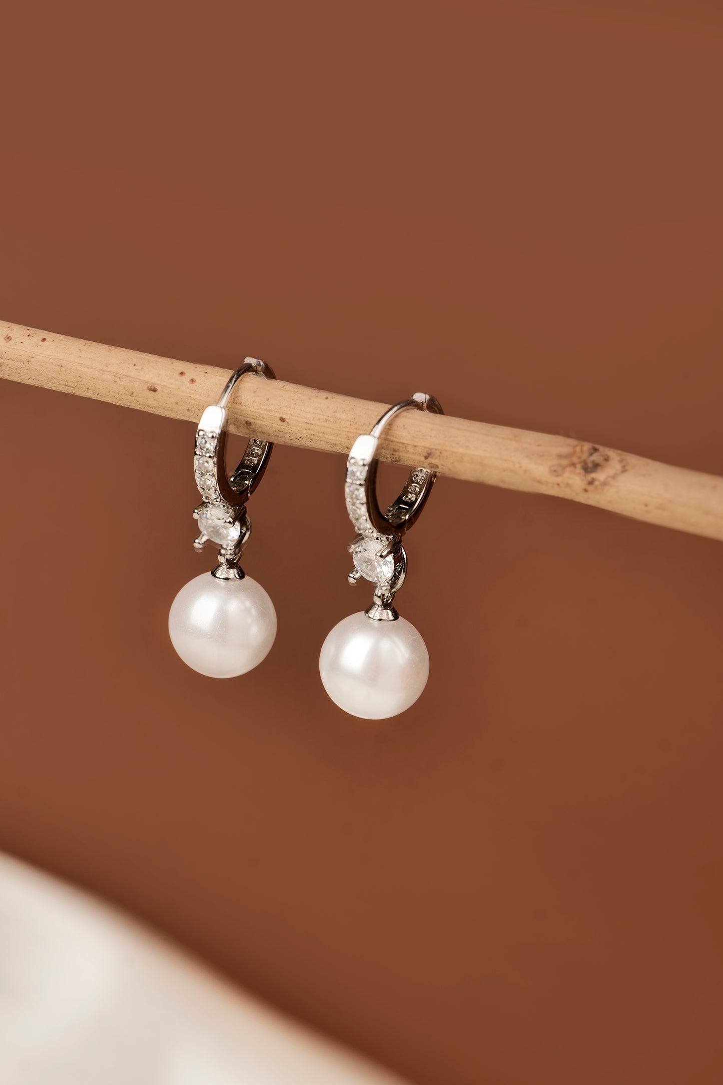PEARL AND AMERICAN DIAMOND STUDDED EARRINGS